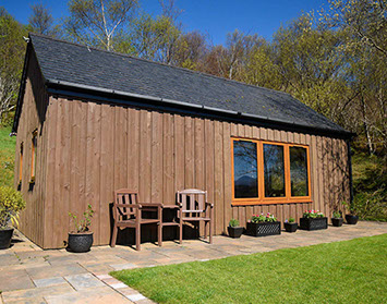 Chracaig Bheag self catering accommodation has an outside seating area with sea views of Portree