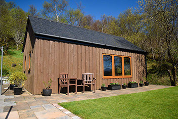 Chracaig Bheag self catering accommodation has an outside seating area with sea views of Portree