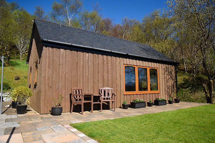 Chracaig Bheag self catering accommodation has an outside seating area with sea views of Portree